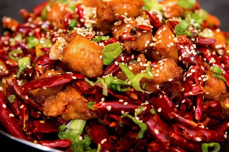 Sichuan-style fried chicken tossed with dried chili peppers and scallions at Z & Y Restaurant
