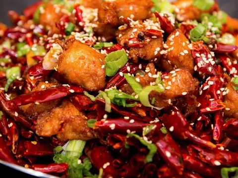 Sichuan-style fried chicken tossed with dried chili peppers and scallions at Z & Y Restaurant
