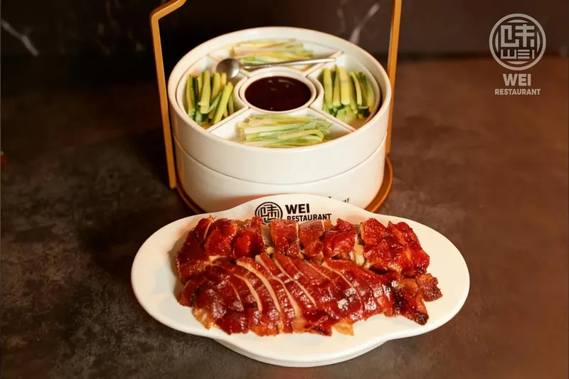 Wei Restaurant roast duck served with steamed pancakes and accompaniments